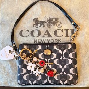 Coach Monogram Black and Cream Wristlet with Charms